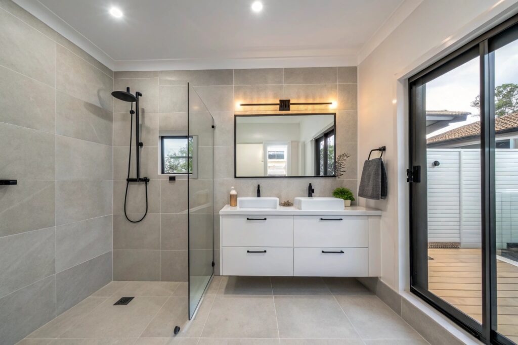 Renovated ensuite bathroom with frameless shower screen and wall-hung vanity in Townsville home