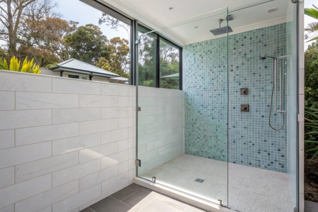 Mosaic tile shower feature wall in a renovated Townsville bathroom
