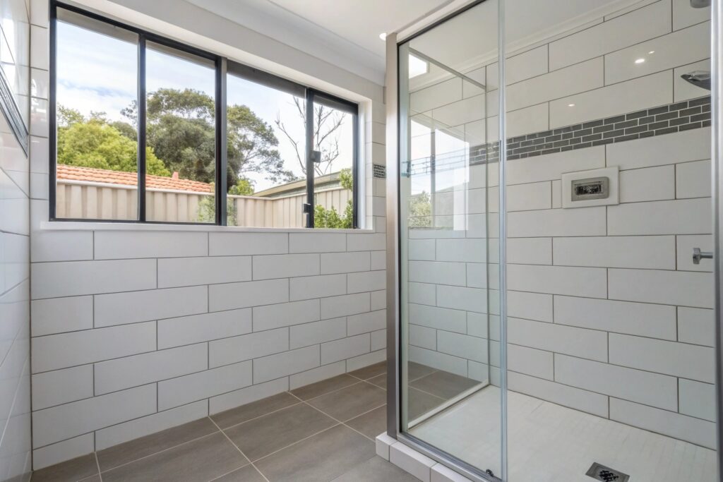 Newly tiled and waterproofed shower recess after water damage leak repair in Townsville